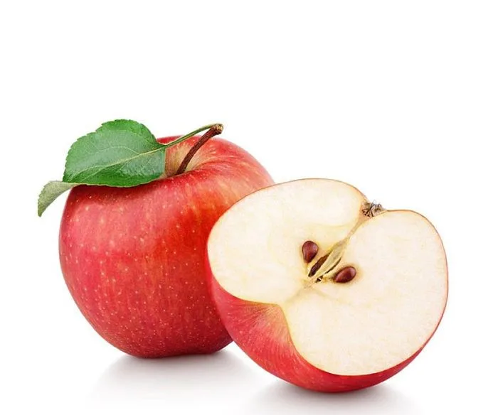 Apple sliced and full apple