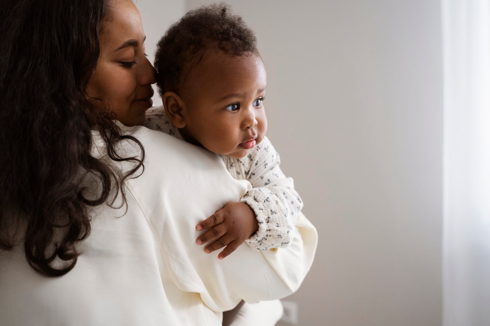 black mother taking car her child 2 scaled