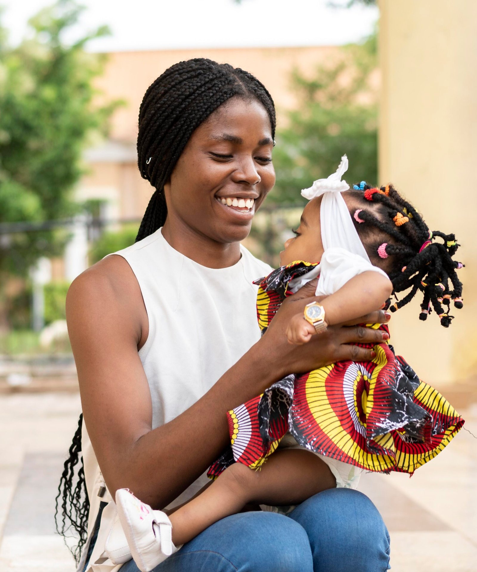 medium shot woman holding little girl scaled